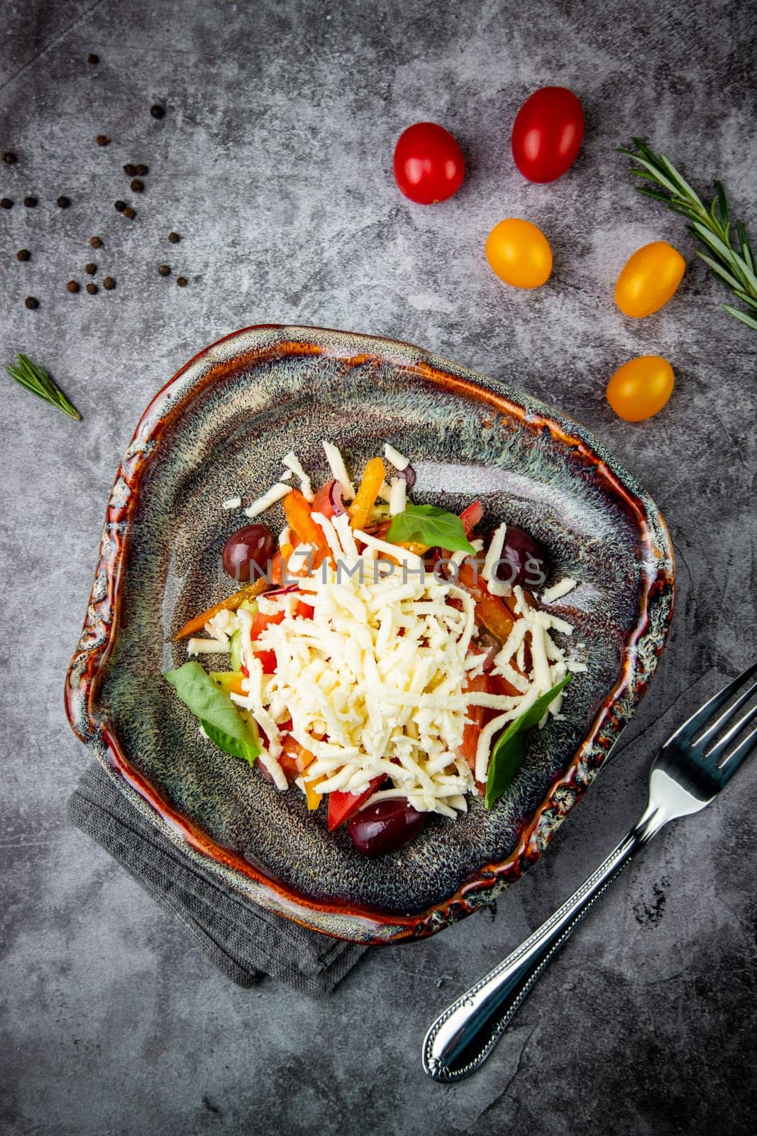 salad with tomatoes, basil, sweet peppers and cheese