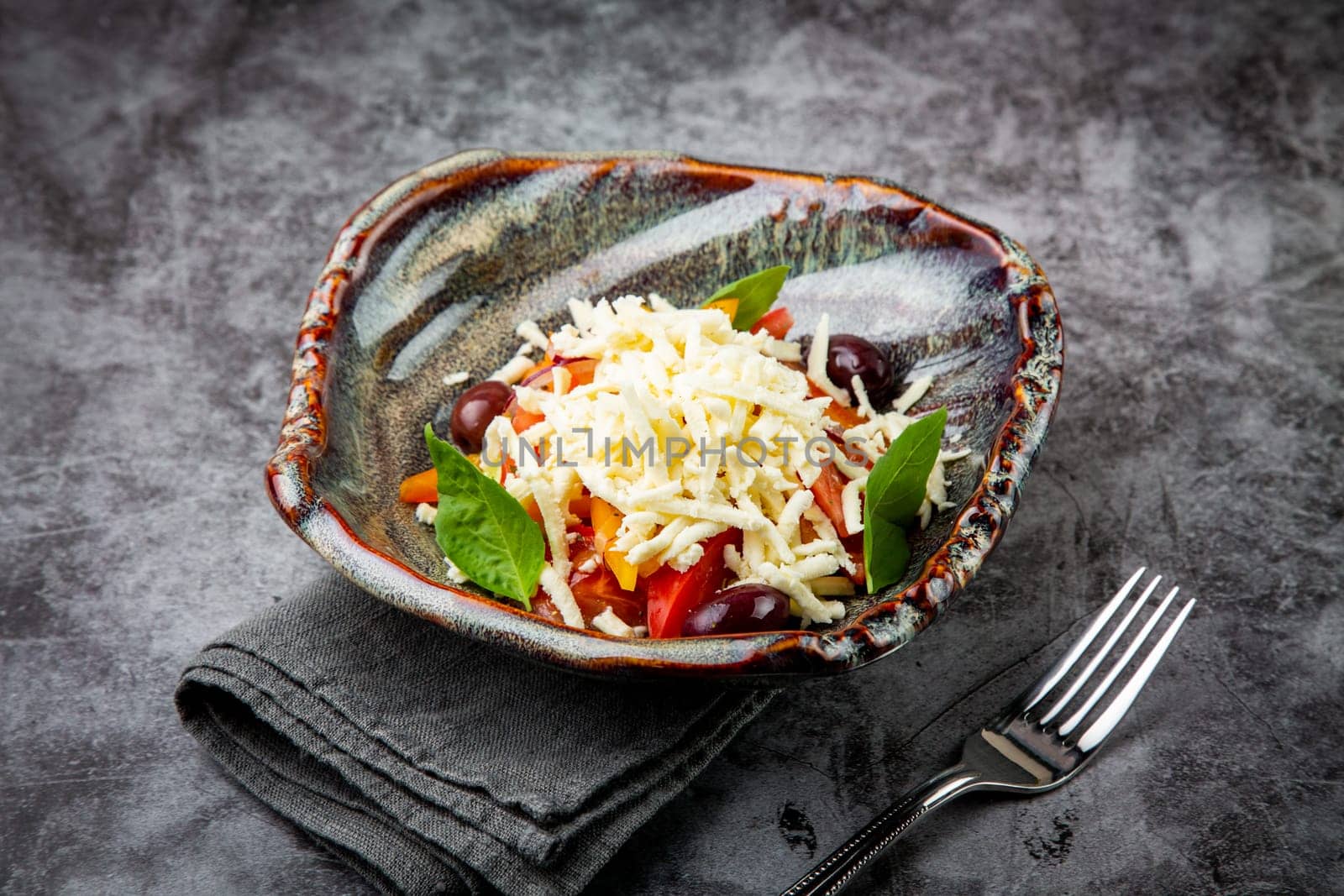 salad with tomatoes, basil, sweet peppers and cheese, side view by tewolf