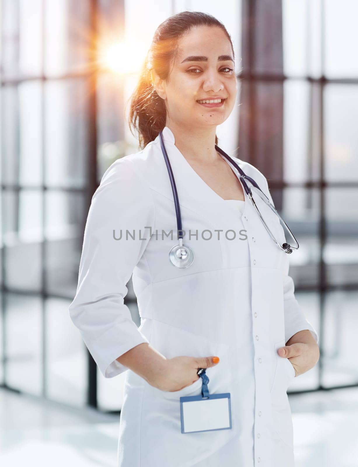 Dentist woman standing with crossed arms. Confident dentist by Prosto