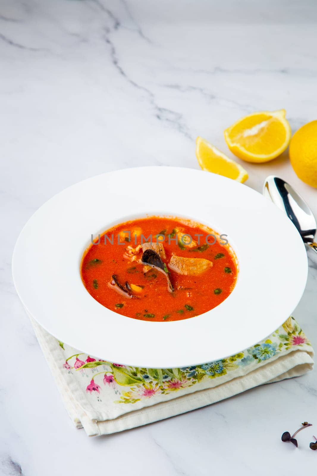 side view of pumpkin cream soup with pieces of meat