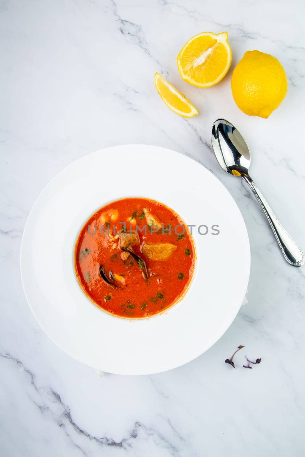 side view of pumpkin cream soup with pieces of meat