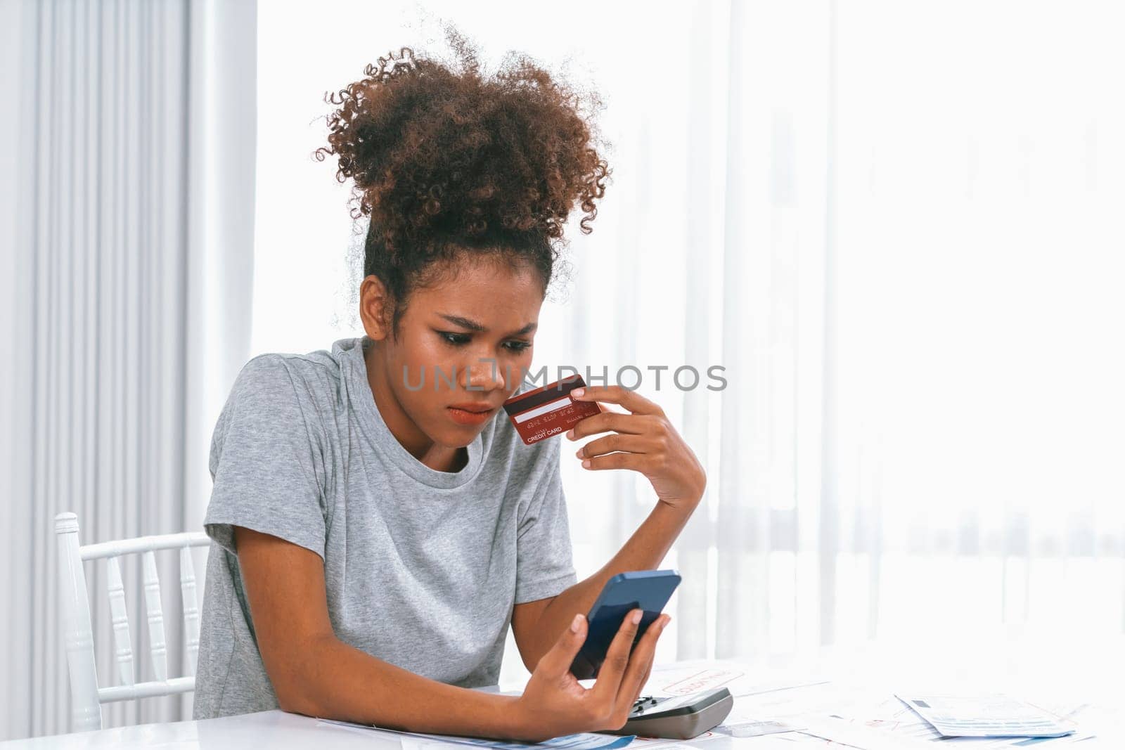 Stressed young woman has financial problems with credit card debt to pay crucial show concept of bad personal money and mortgage pay management crisis. sad and unhappy