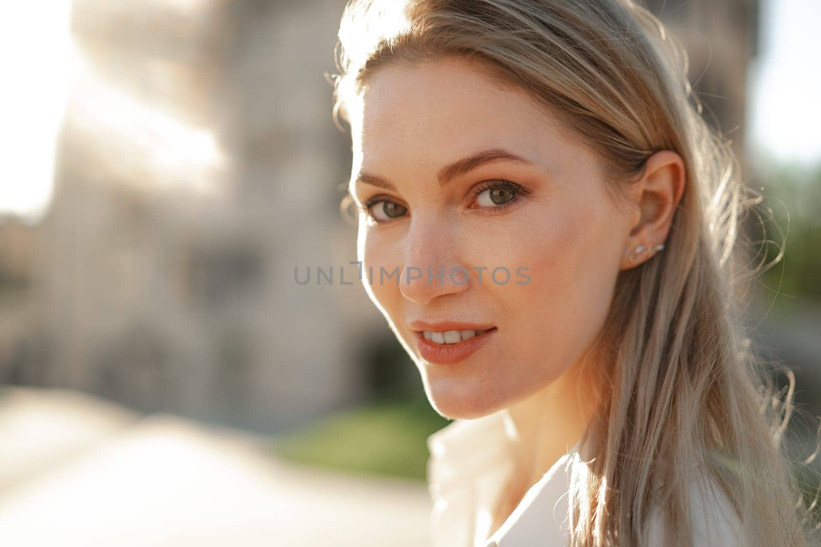 Close up portrait of young blonde businesswoman outdoors