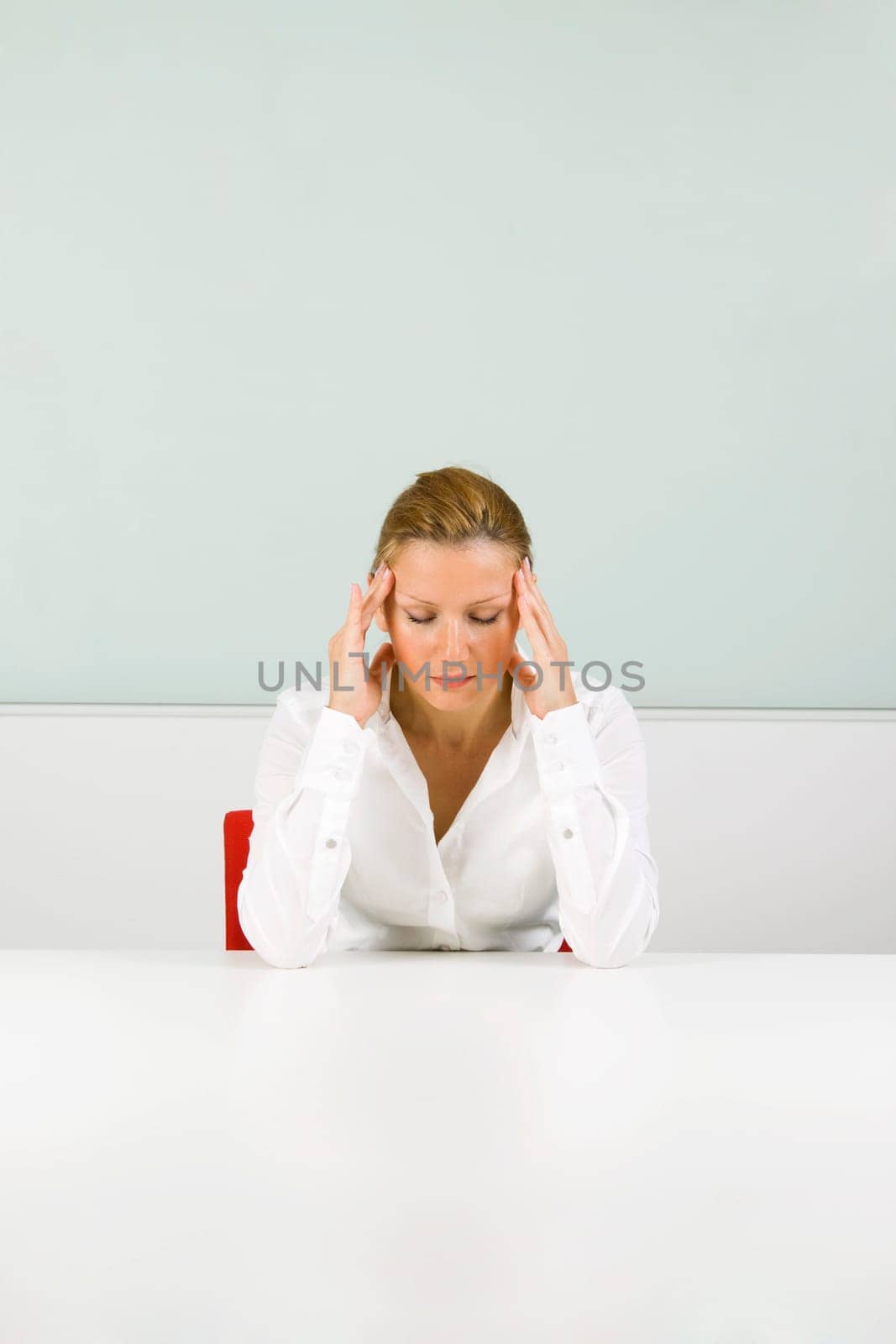 Young businesswoman in stress