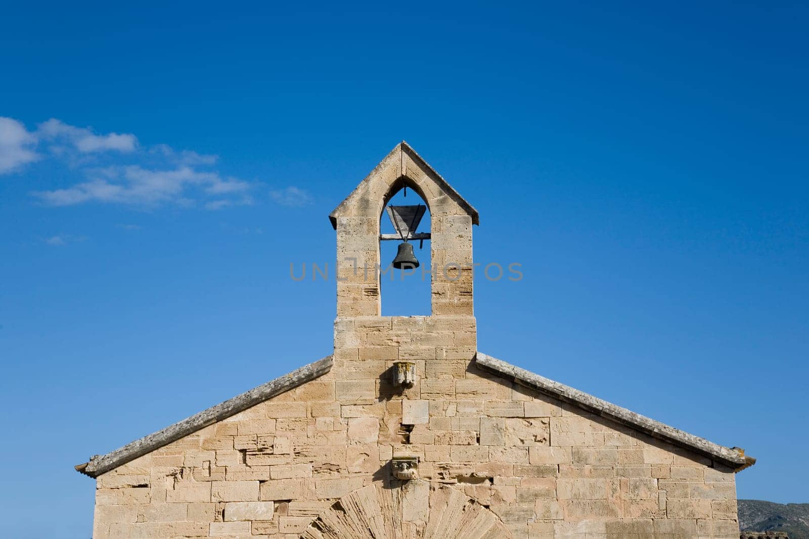 Church tower with bell in Mallorca