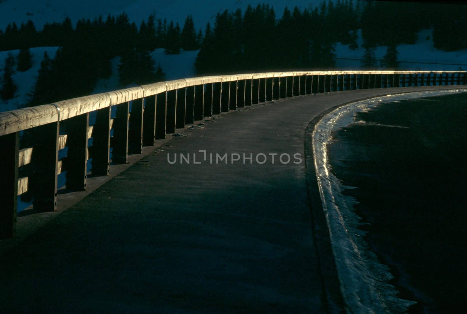 Walkway with bridge railing in backlight