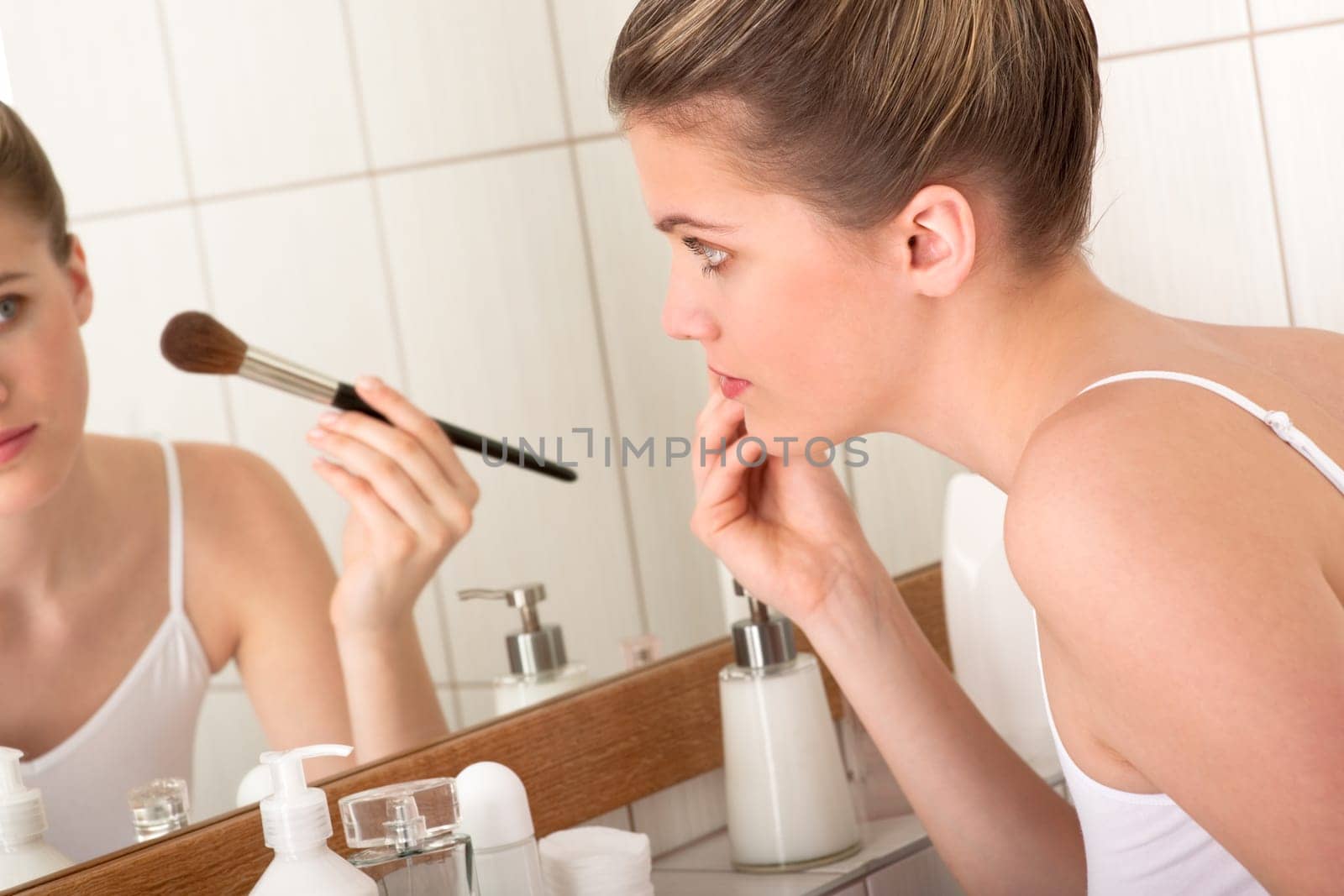 Body care series - Woman applying powder