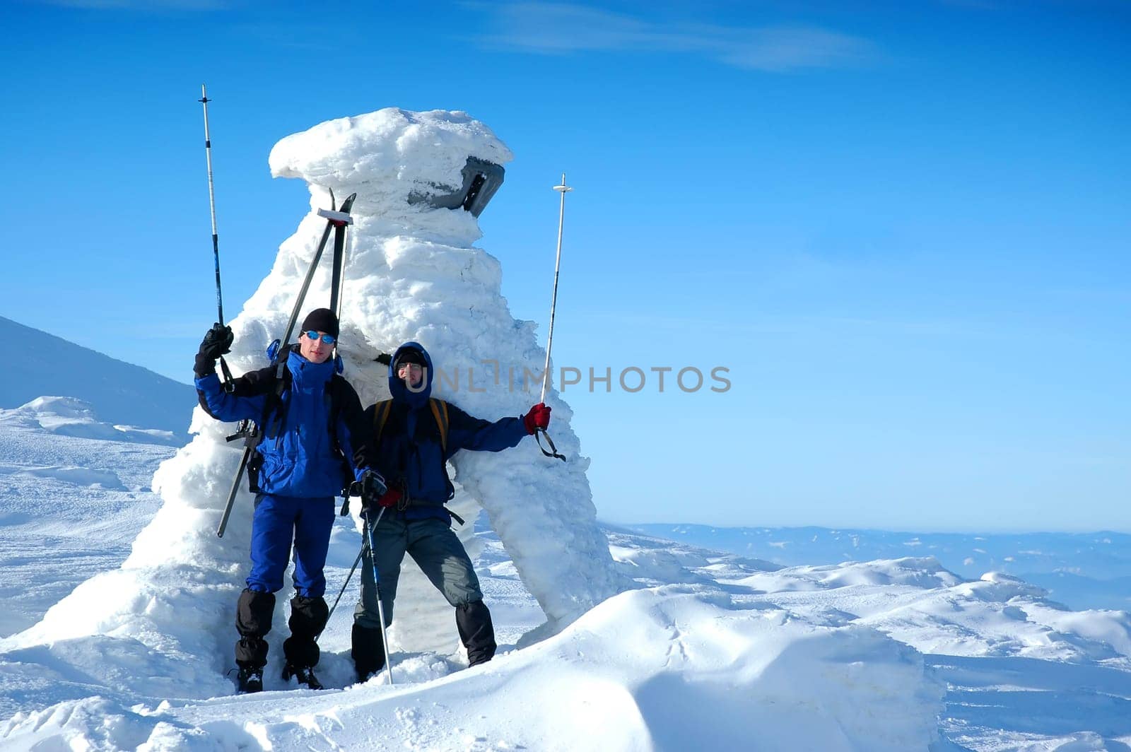 Jubilant skiers on top of mountain