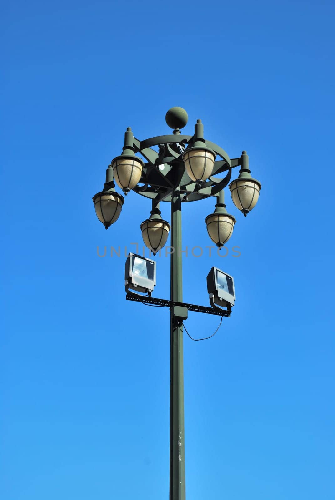 Ancient lamp on sidewalk