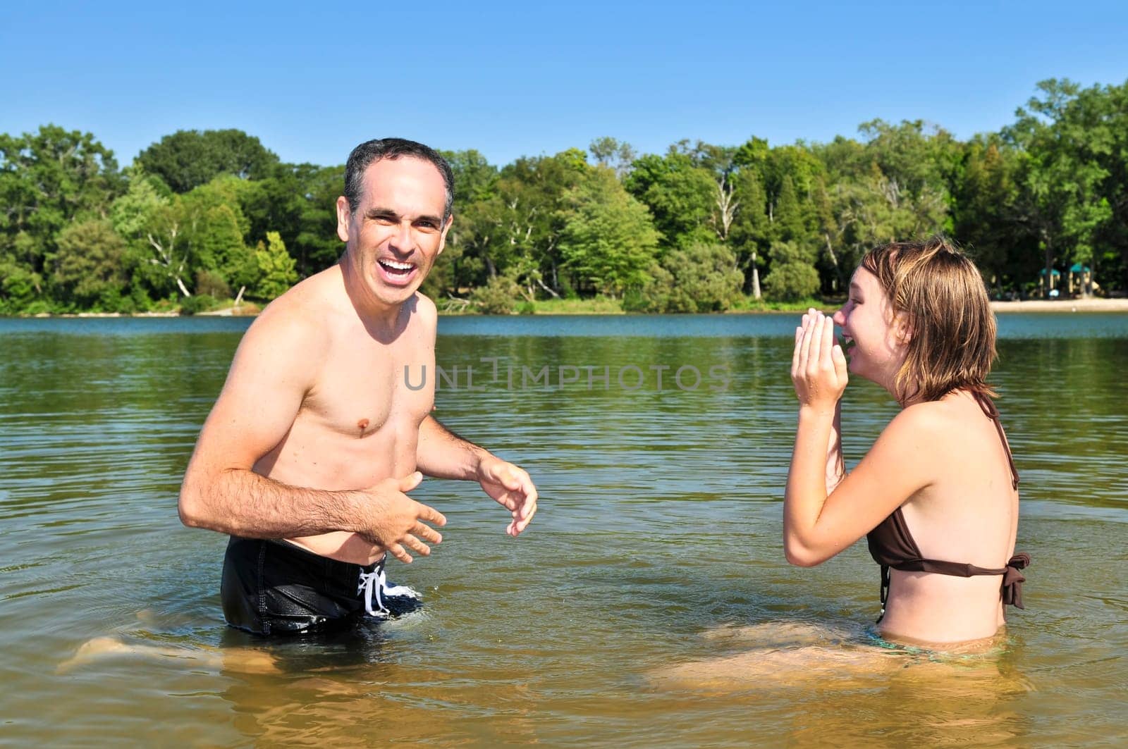 Family splashing in lake