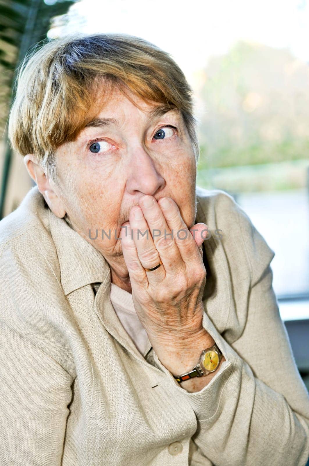 Scared elderly woman