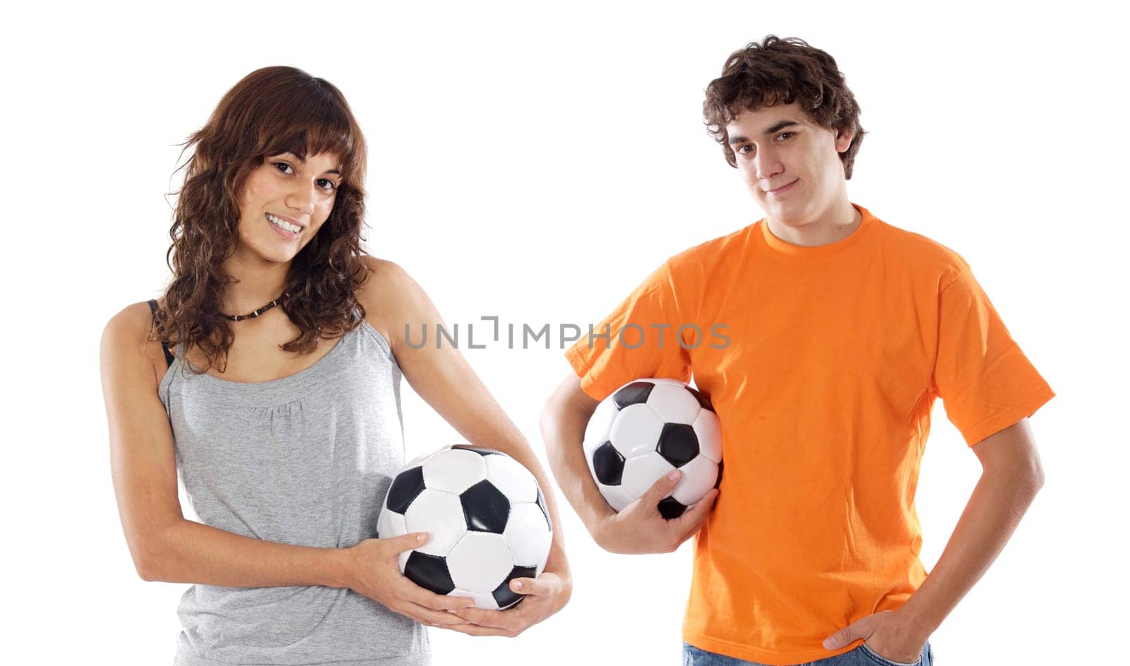 Couple of teenagers with soccer balls
