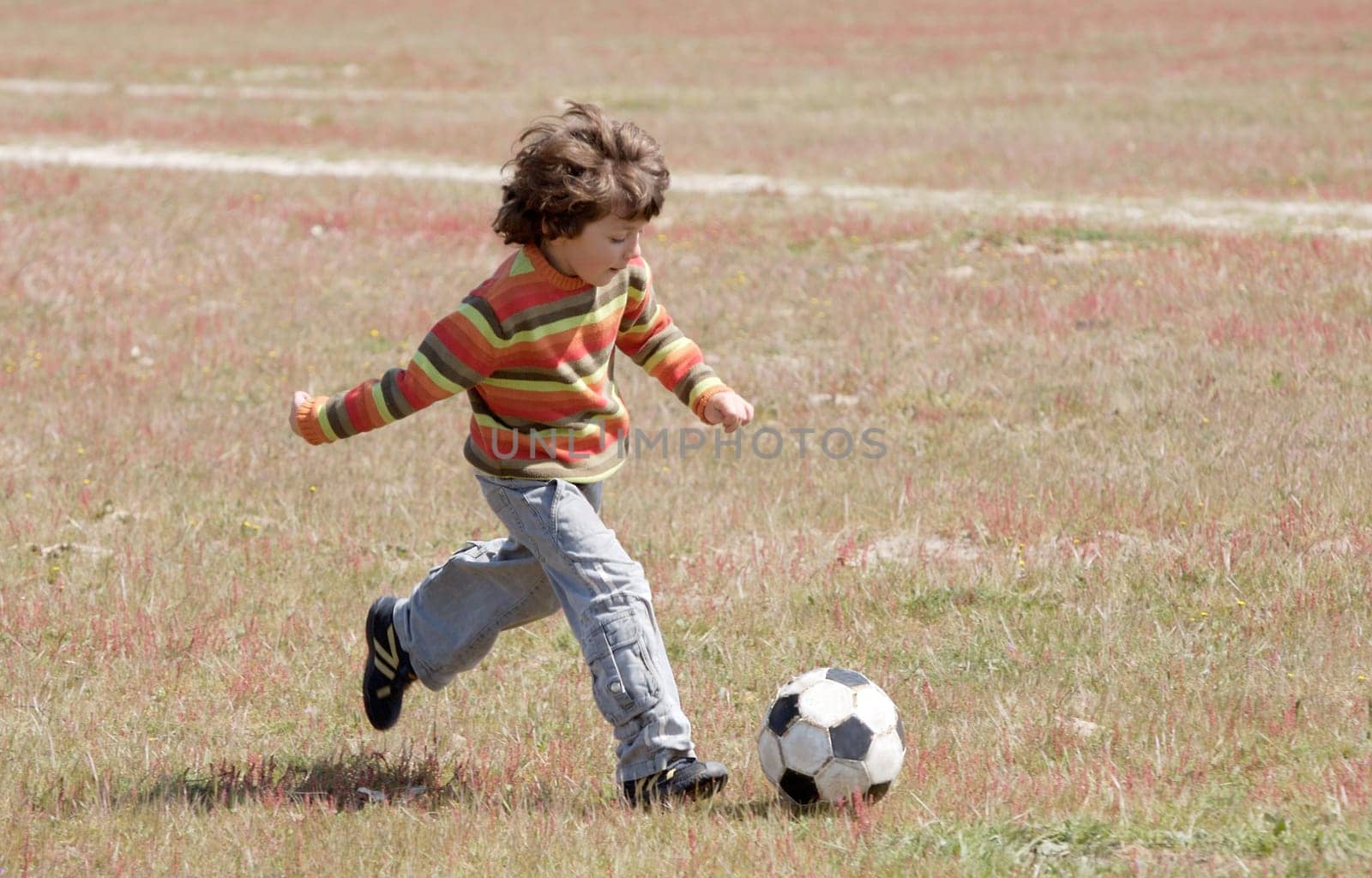 Child playing football