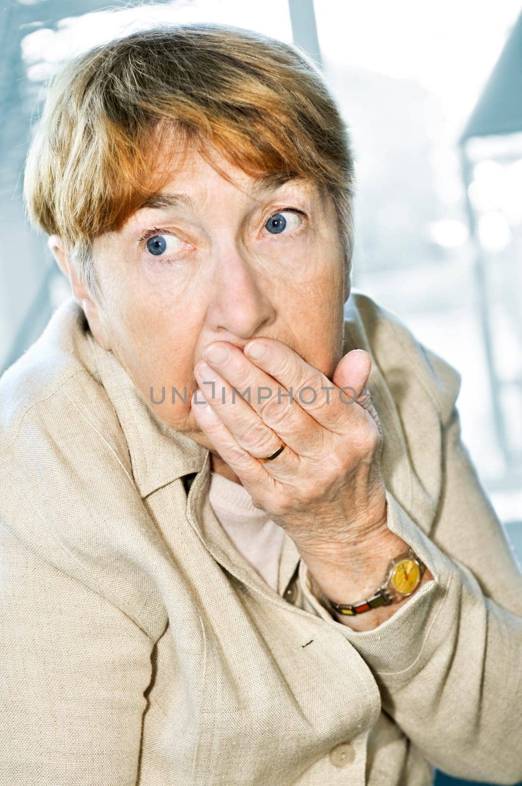 Scared elderly woman