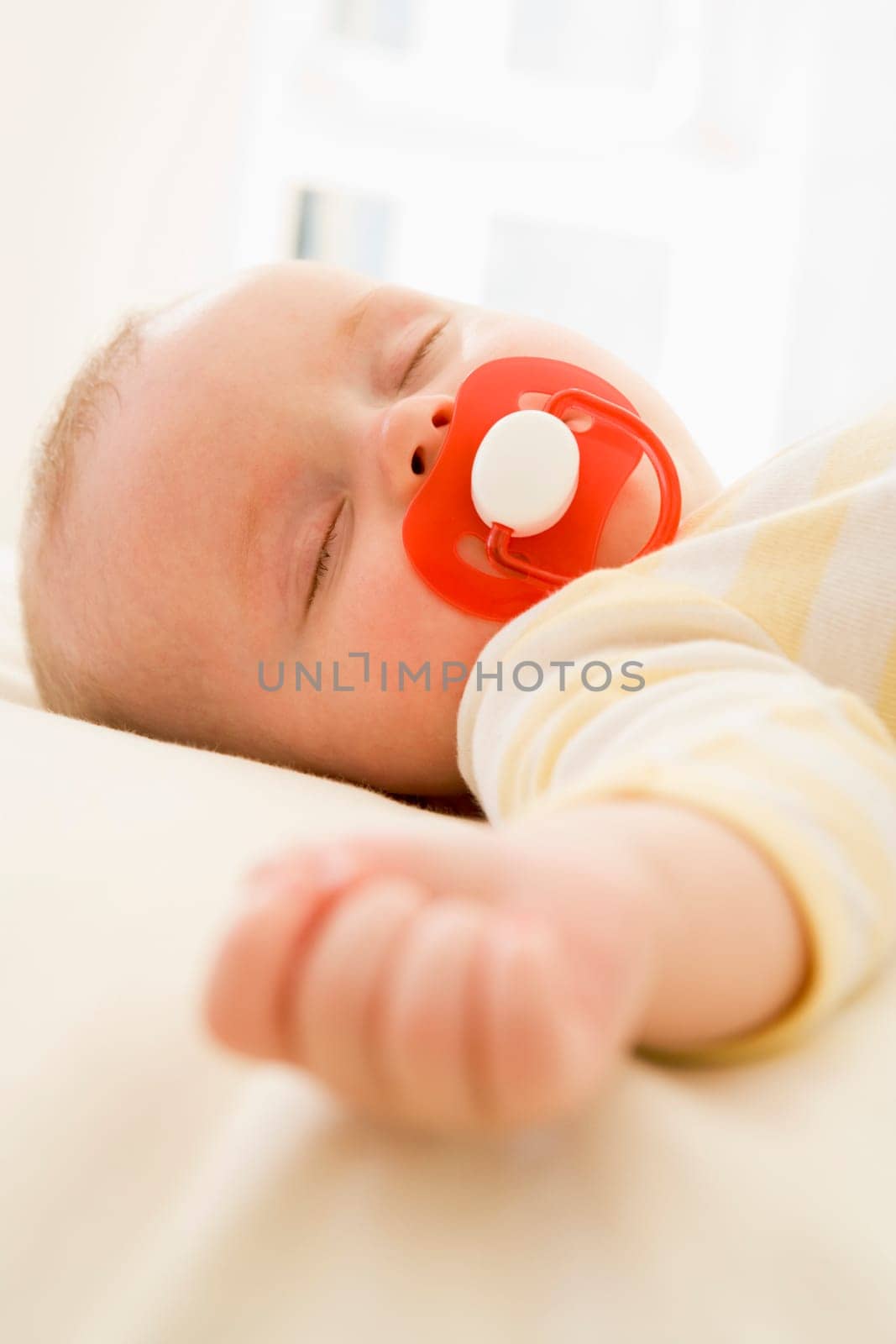 Baby lying indoors sleeping