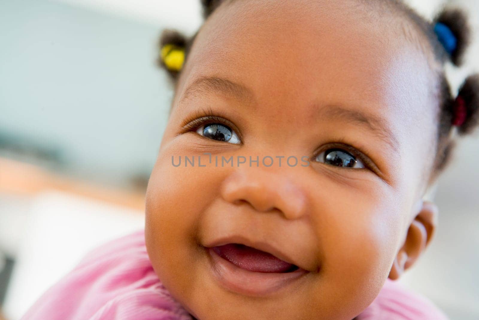Baby indoors smiling