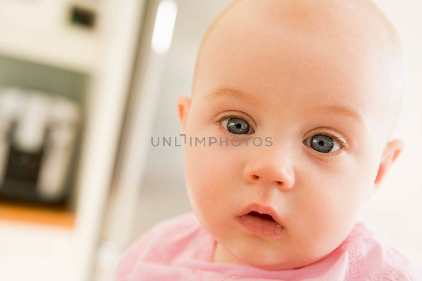 Baby's face in kitchen
