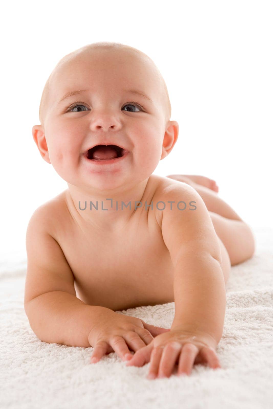 Baby lying down smiling