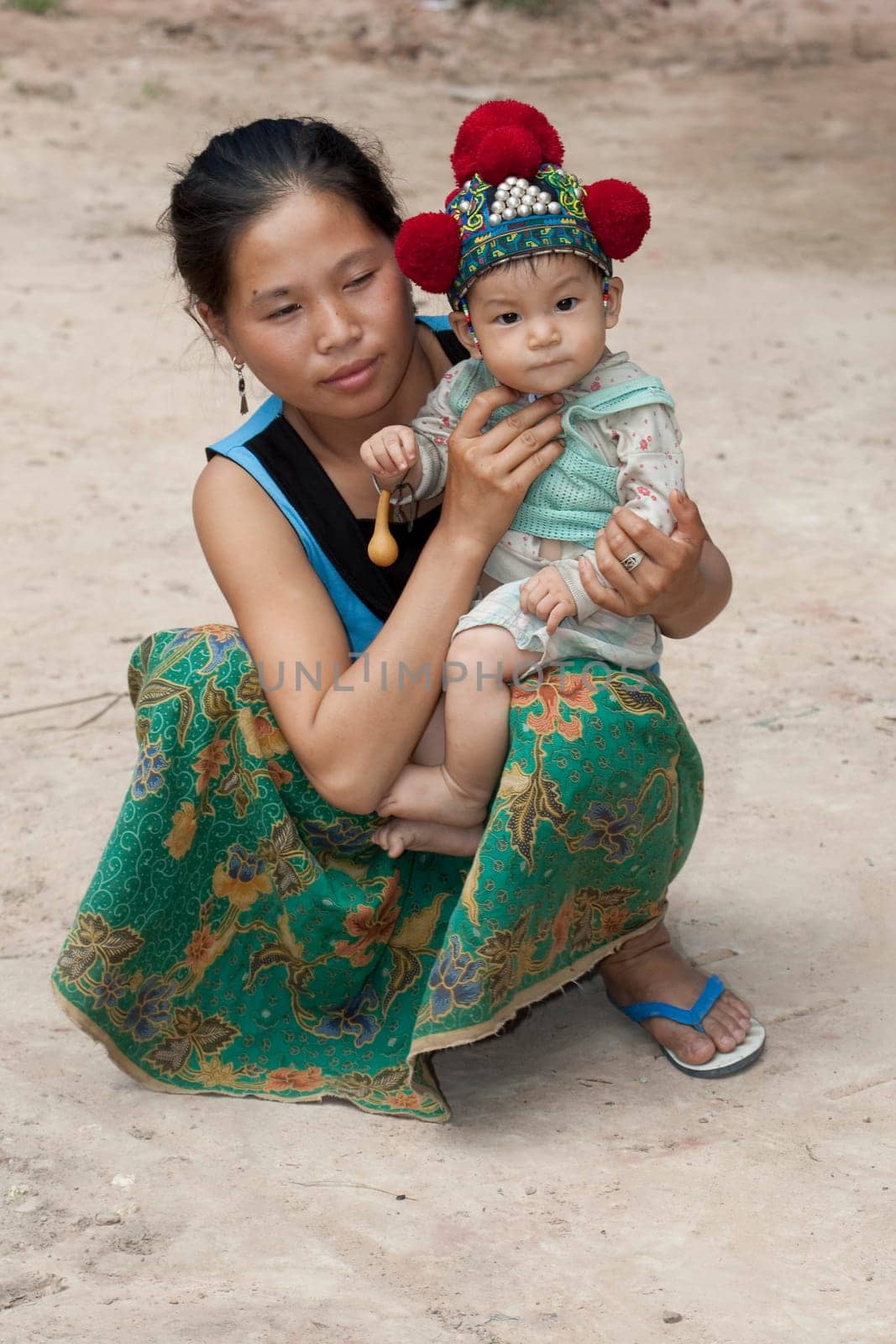 Laos,Asian mother with baby of Yao ethnic group