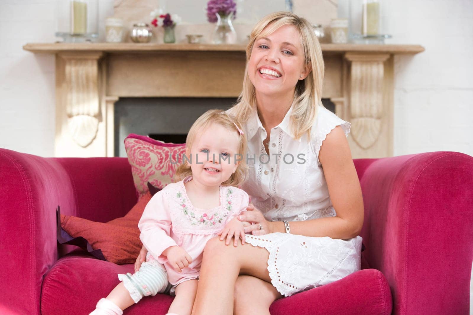 Mother in living room with baby smiling