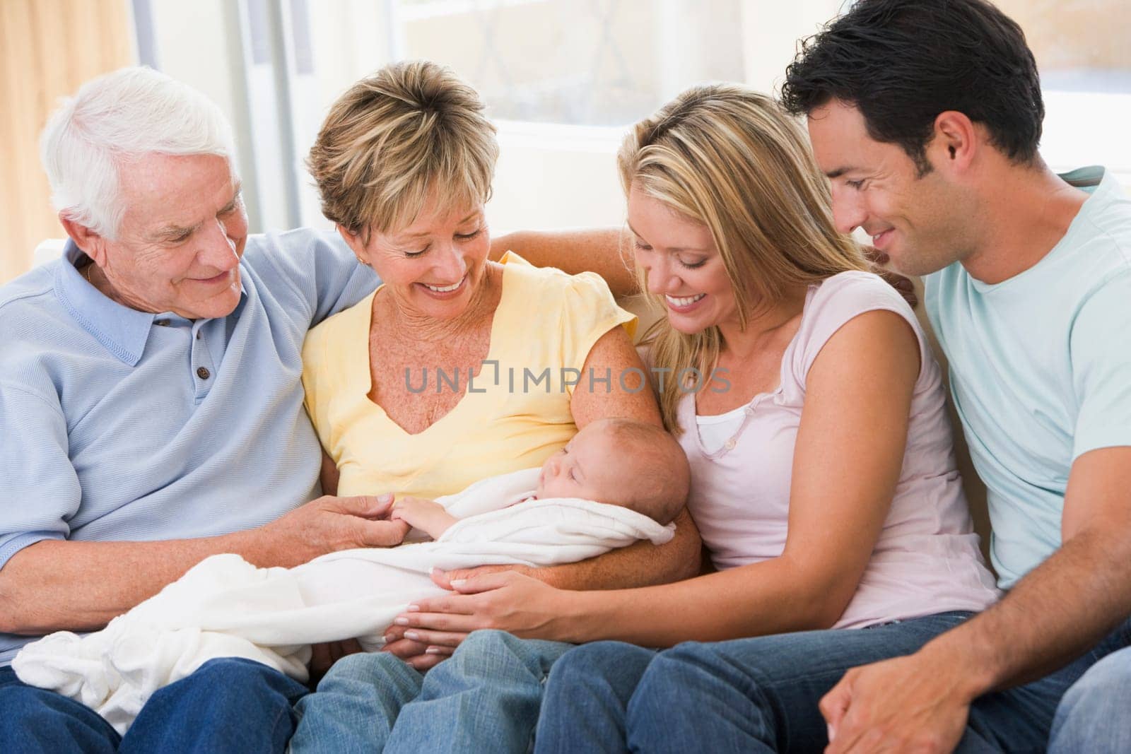 Family in living room with baby smiling
