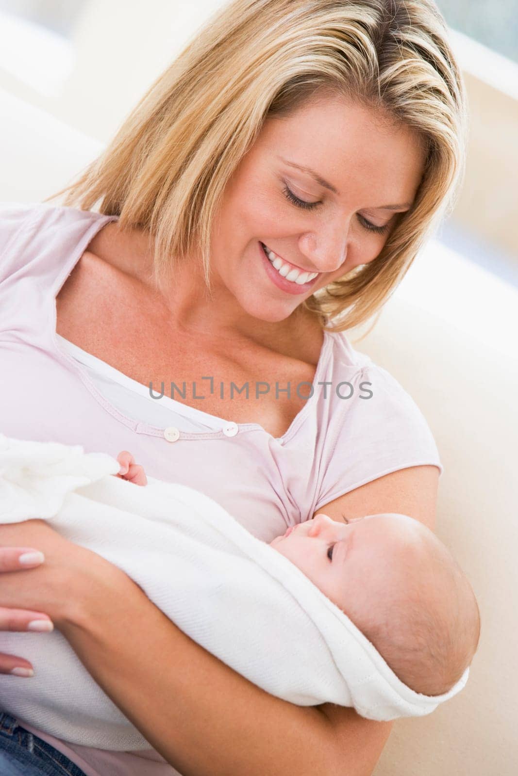 Mother in living room with baby smiling
