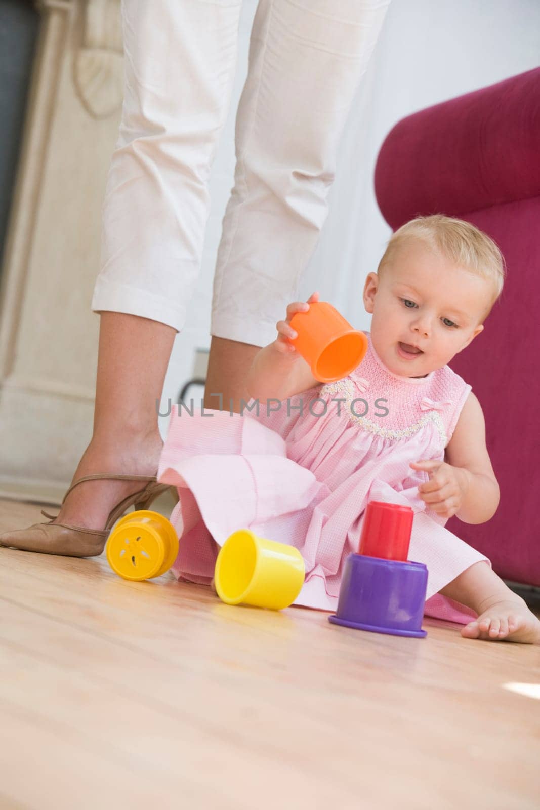 Mother in living room with baby playing