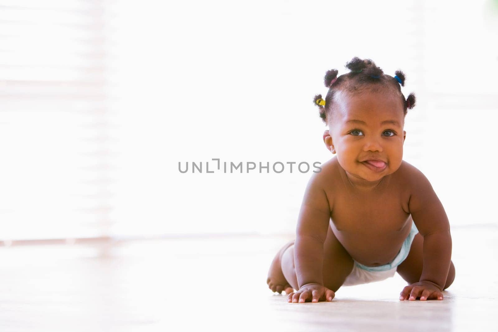 Baby crawling indoors
