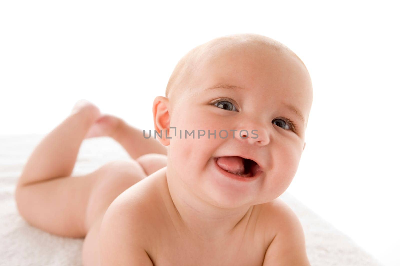 Baby lying down smiling