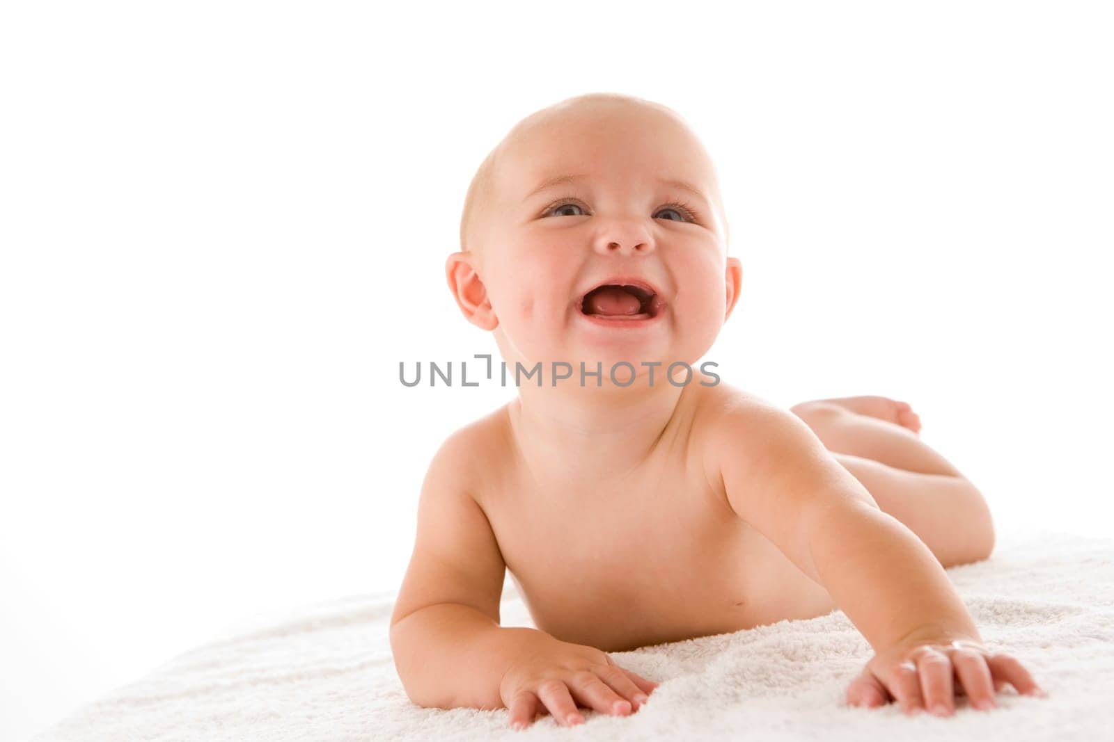 Baby lying down smiling