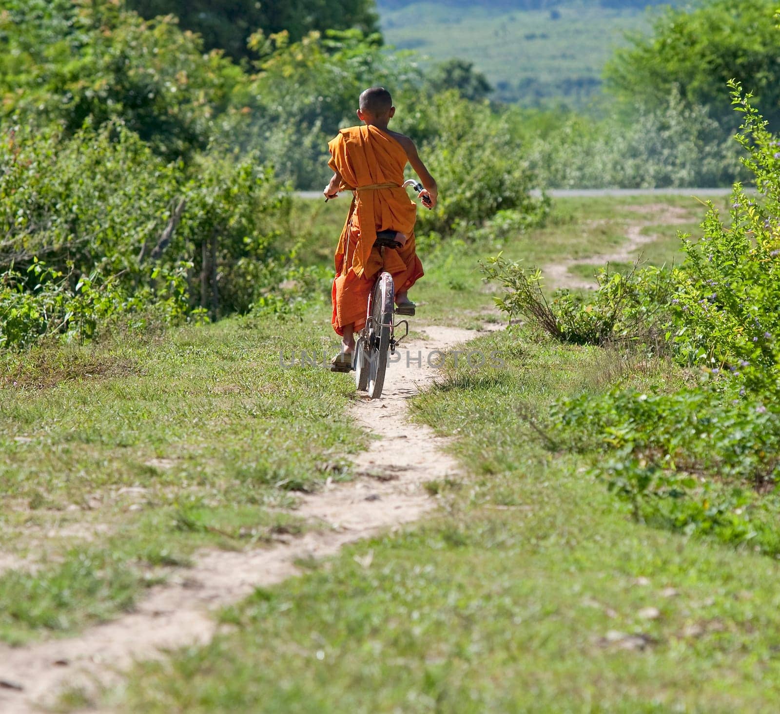 Buddhist monk on bicycle