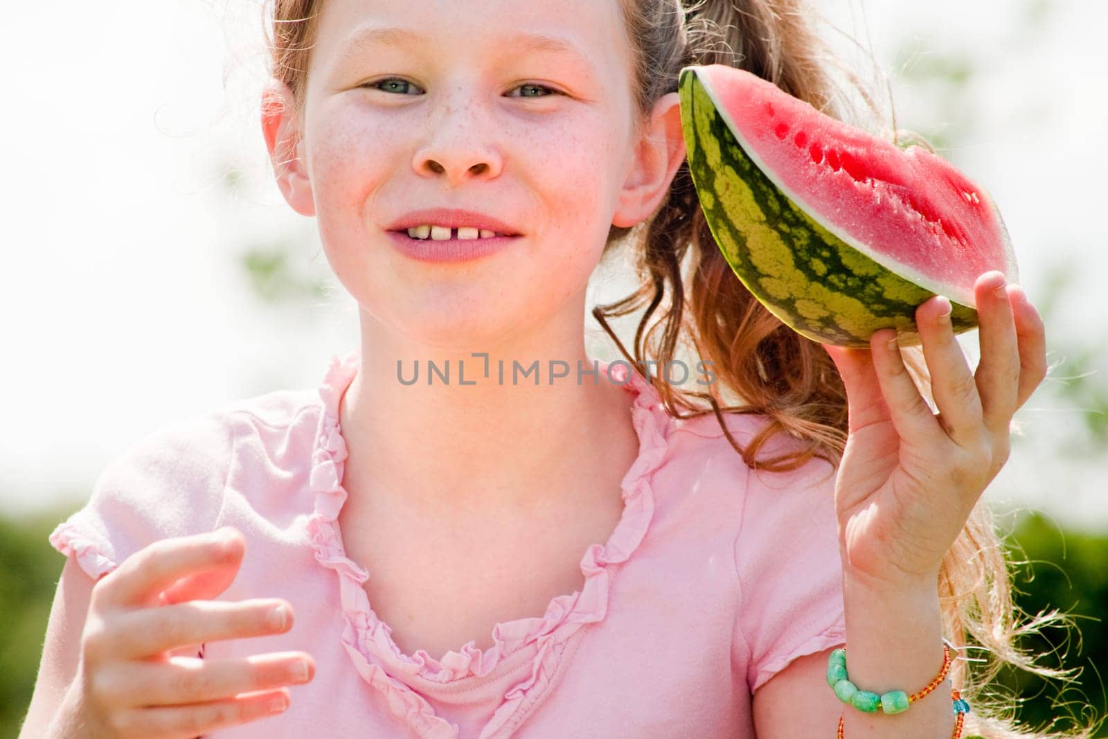 Little girl and her watermelon