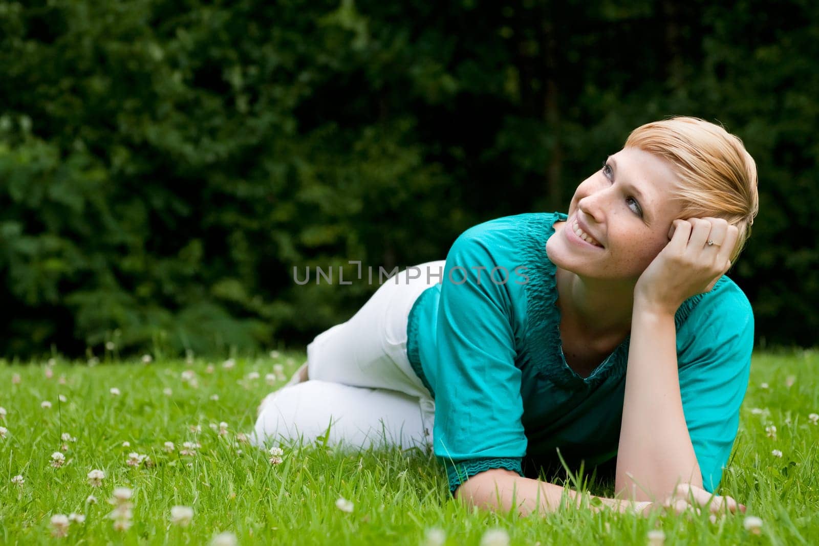 laying down on the grass