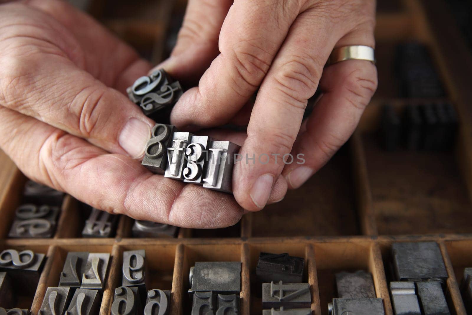 metal numbers in hands