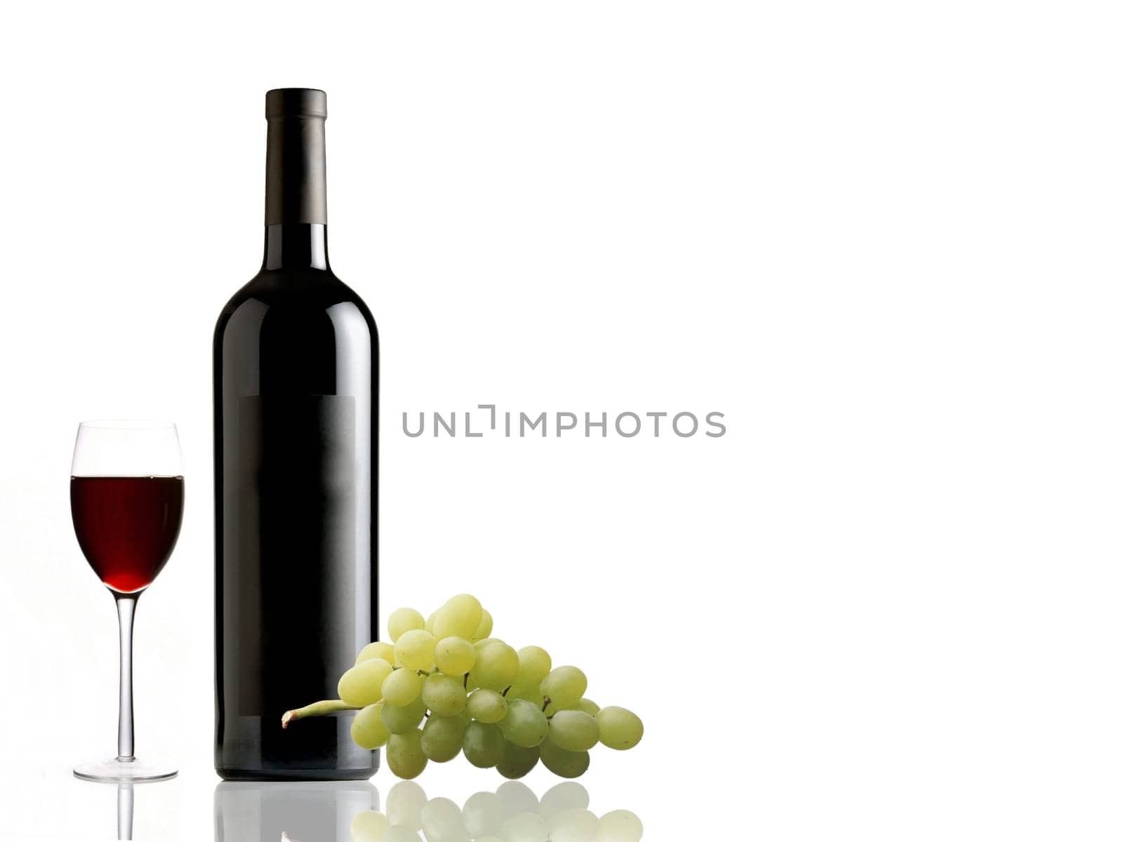 Bottle of red wine, glass and grape