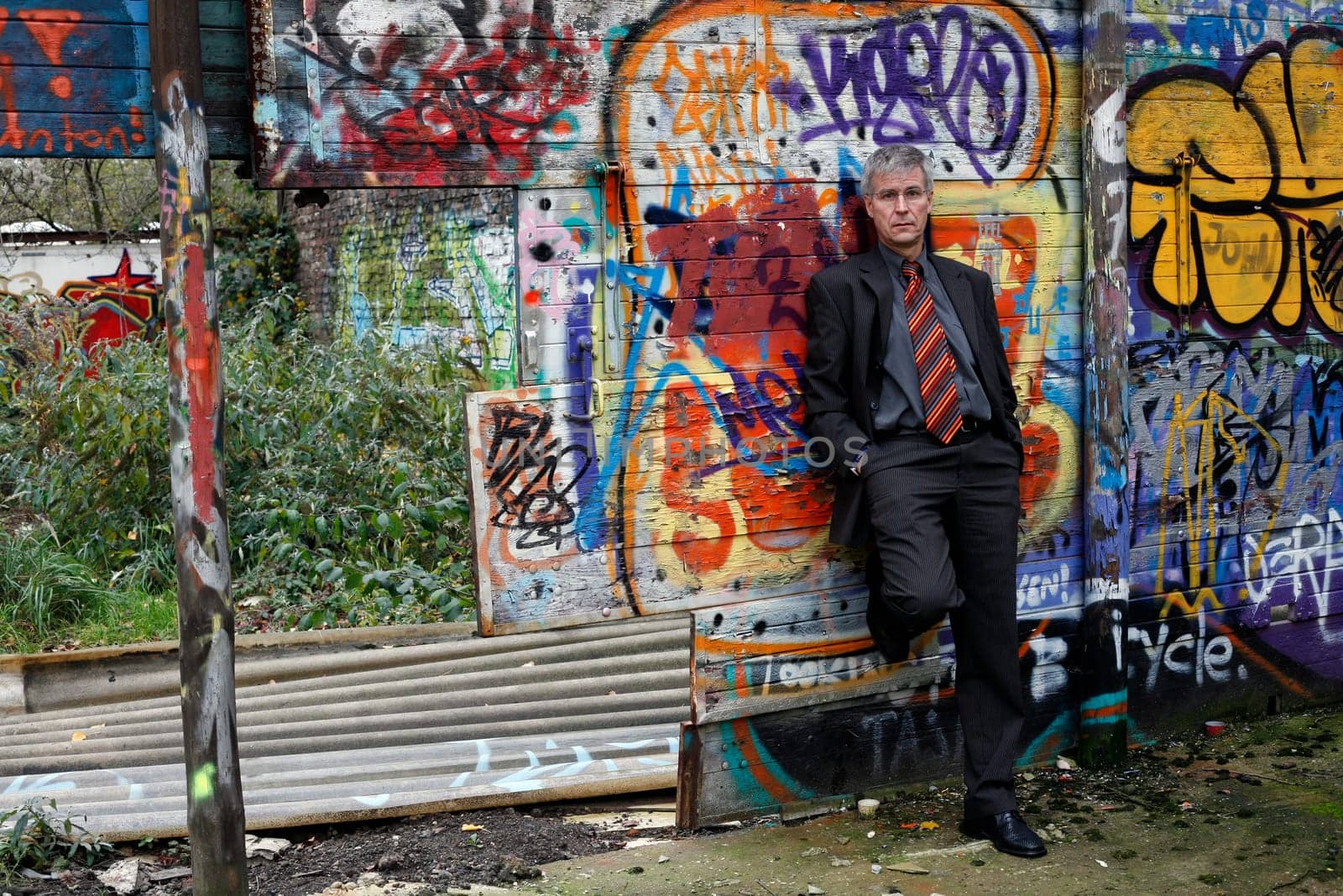 Man in Suit at Grafity Wall