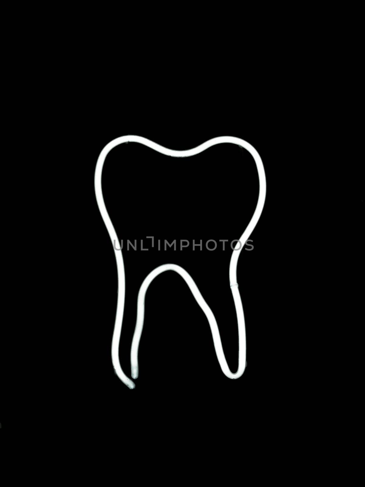 Neon tooth shaped sign