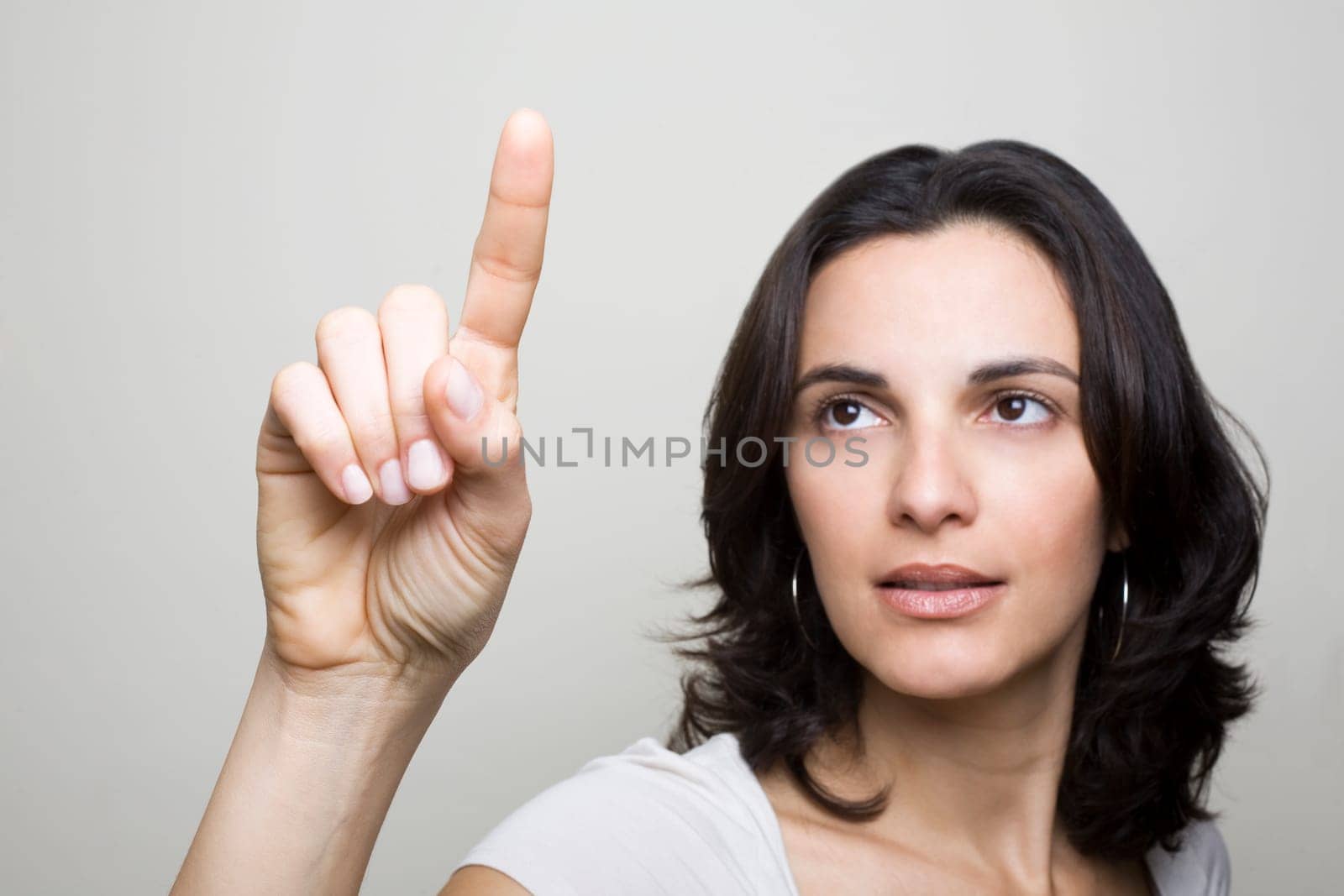 Woman presses on a virtual screen