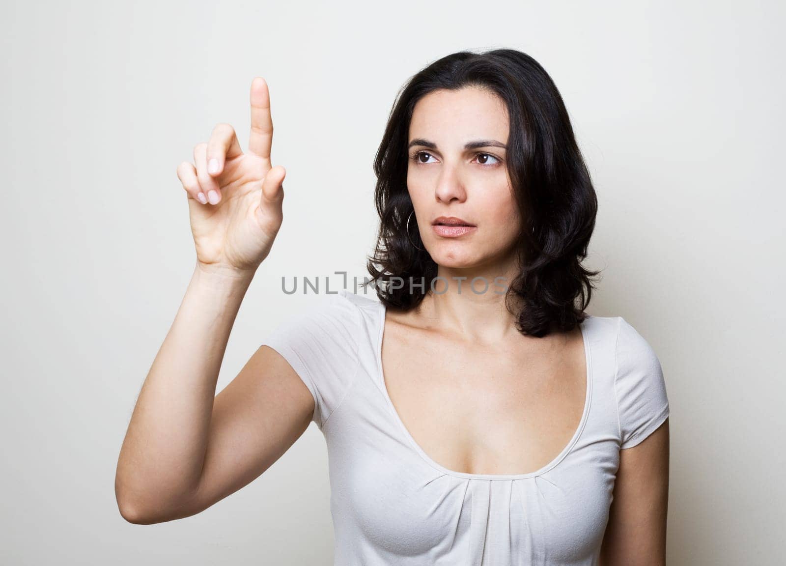 Young woman presses on a virtual