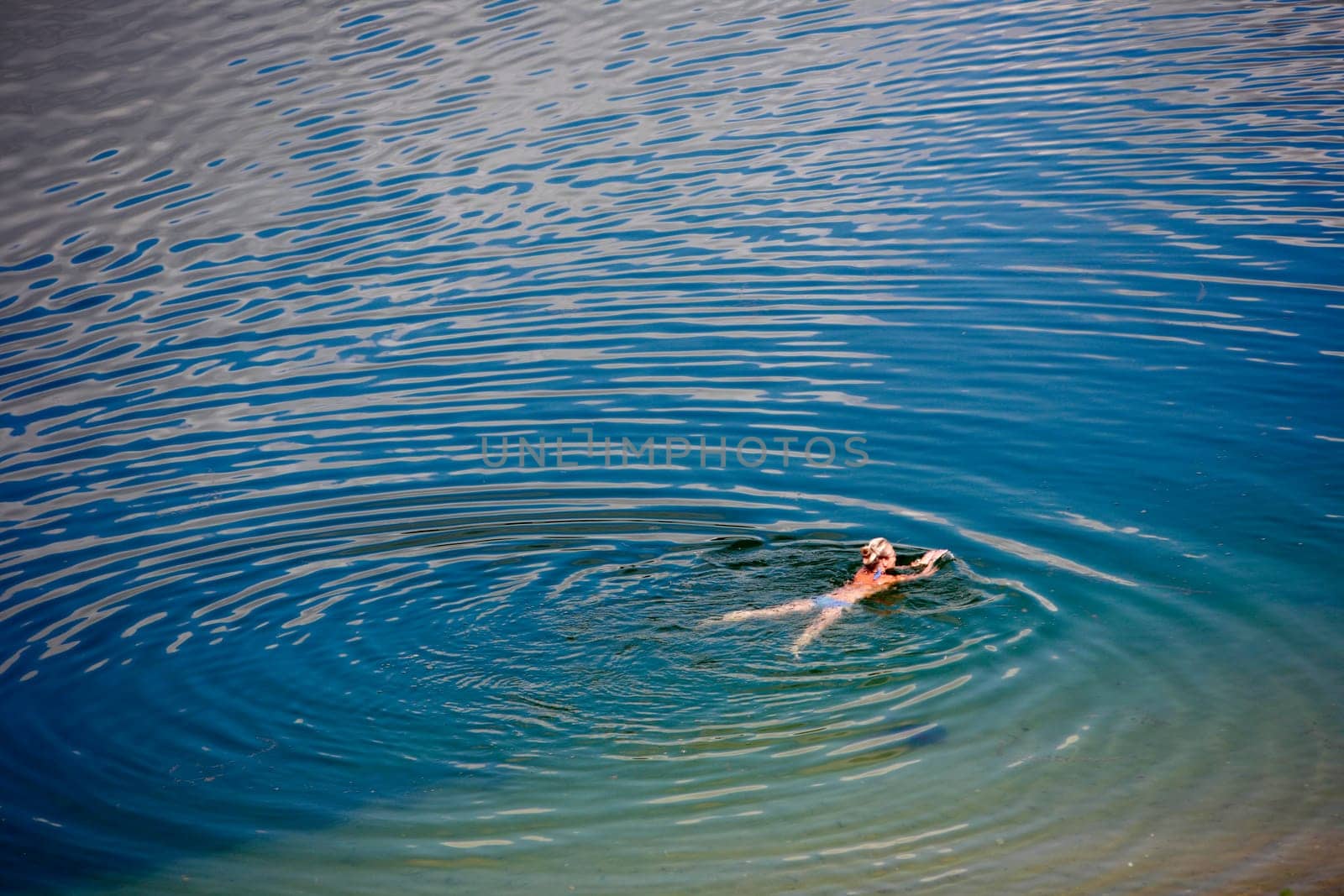 Woman swimming in a lake