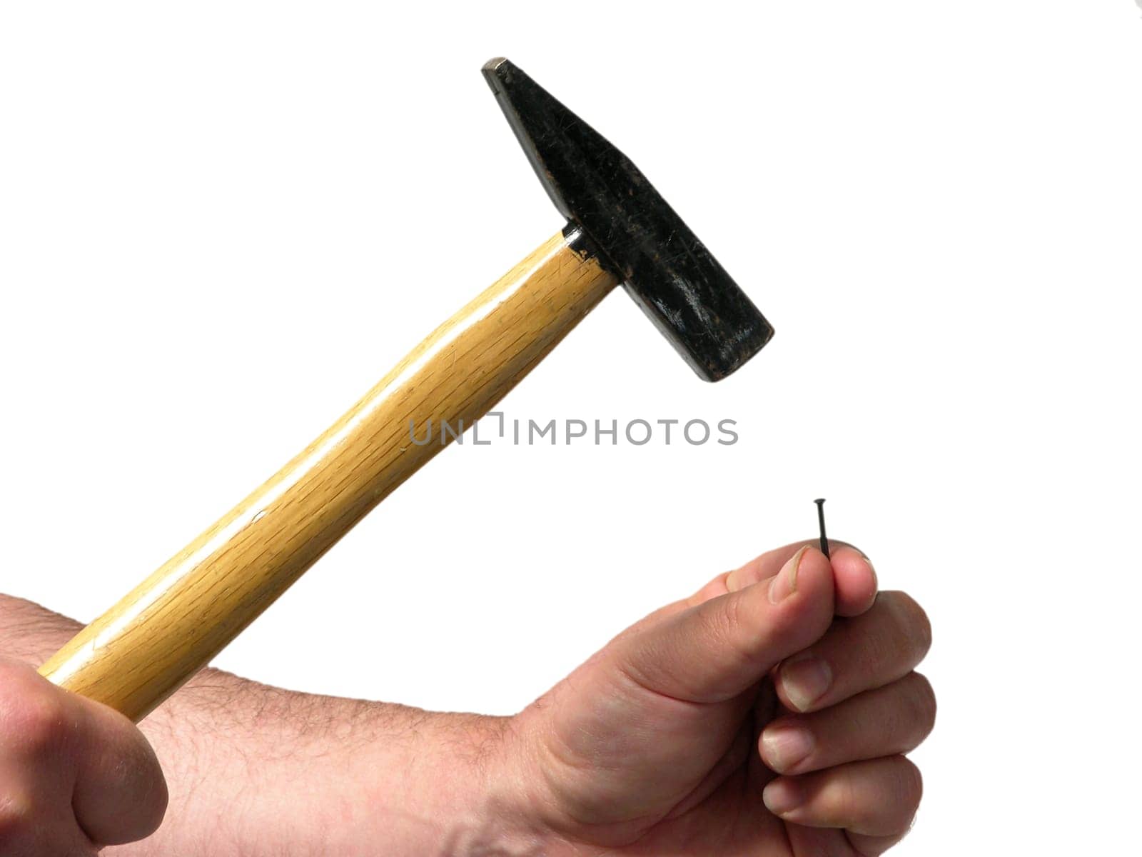 Hitting a nail with a hammer