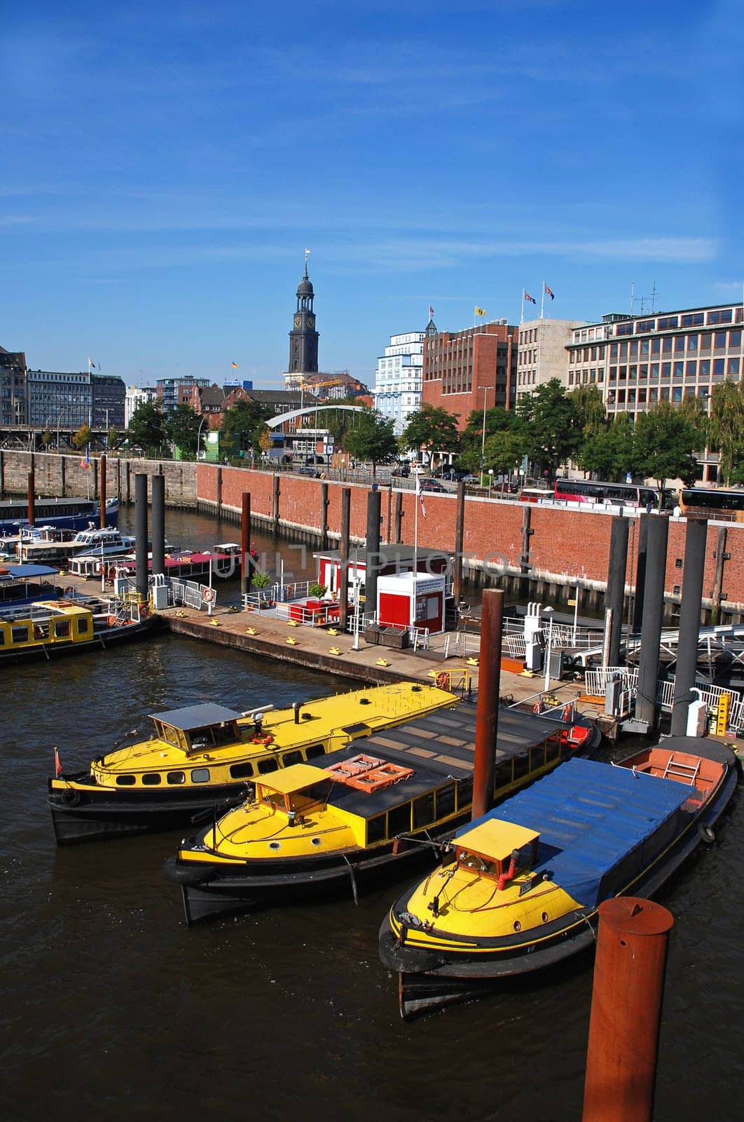 yellow tugboats in the port of Hamburg