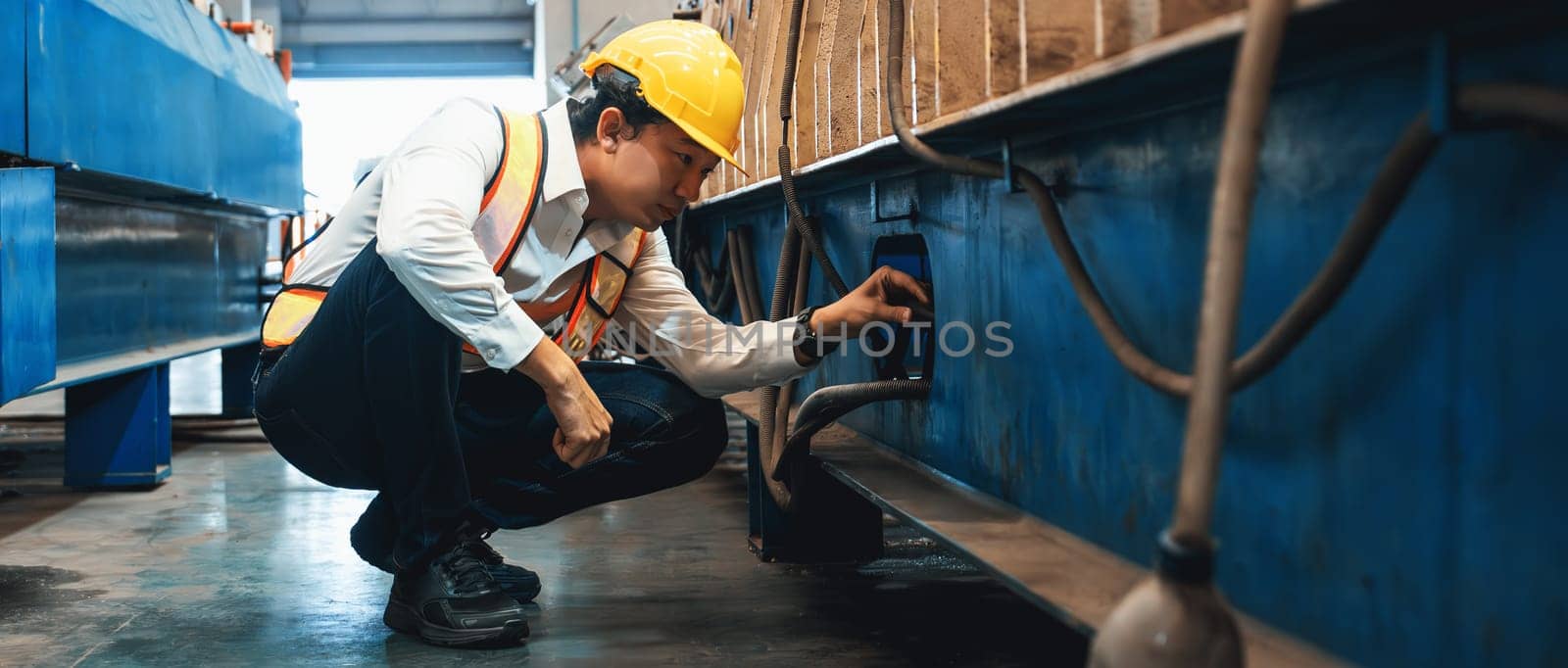 Engineer or foreman inspector conduct professional inspection on machinery assembly line. Manufacturing engineering in factory concept with machinery safety and quality control. Panorama Exemplifying
