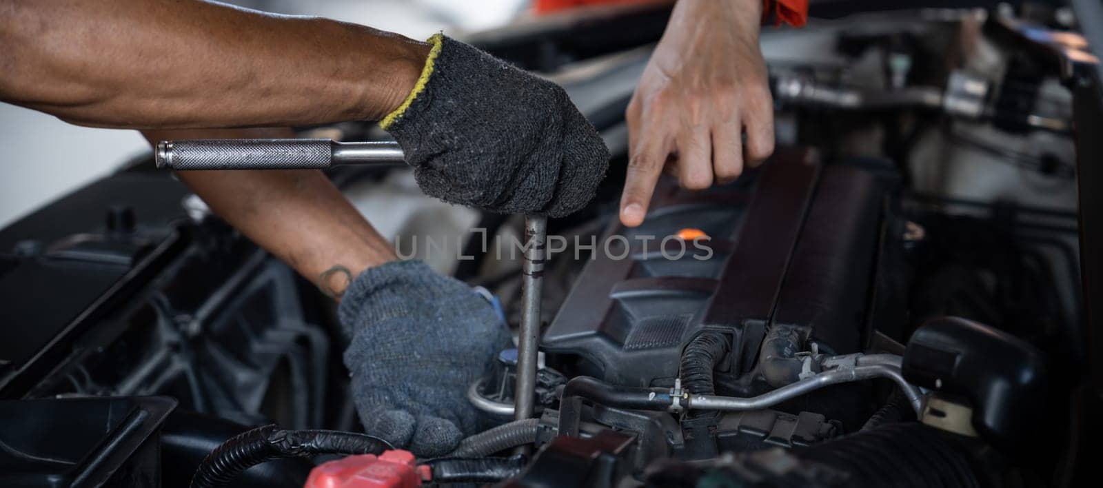 Automotive service mechanic inspect and diagnose car engine. Pano Oxus by biancoblue