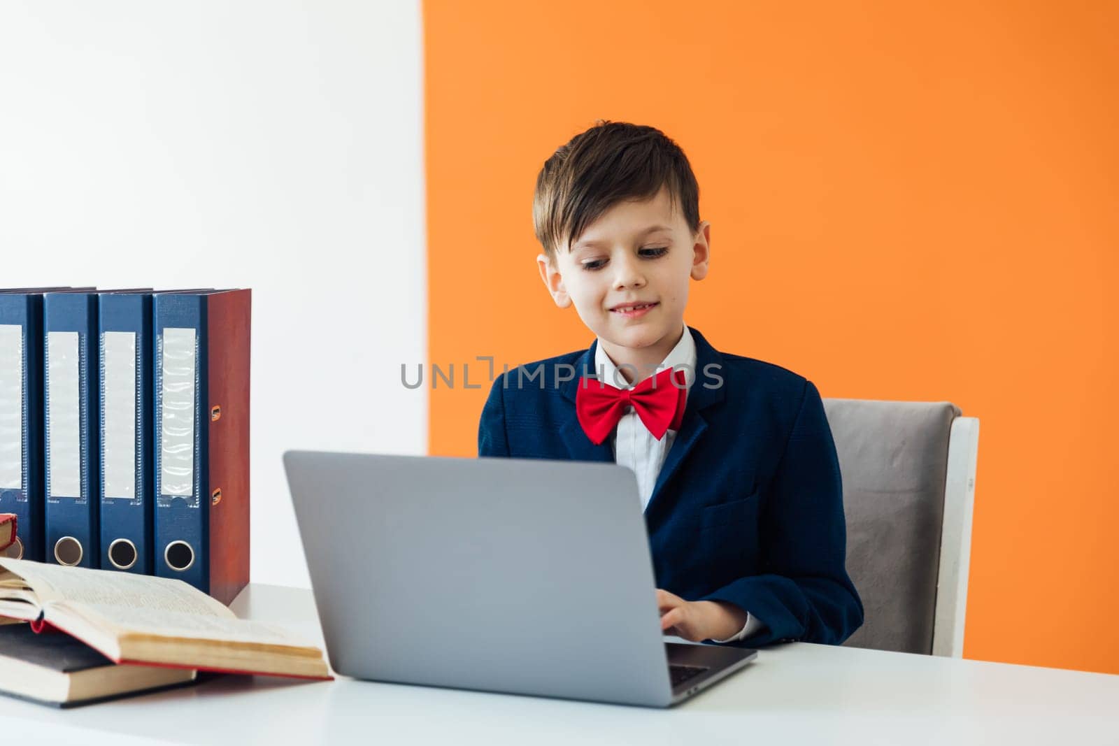 student sitting in the classroom at laptop with books in the office education online programming
