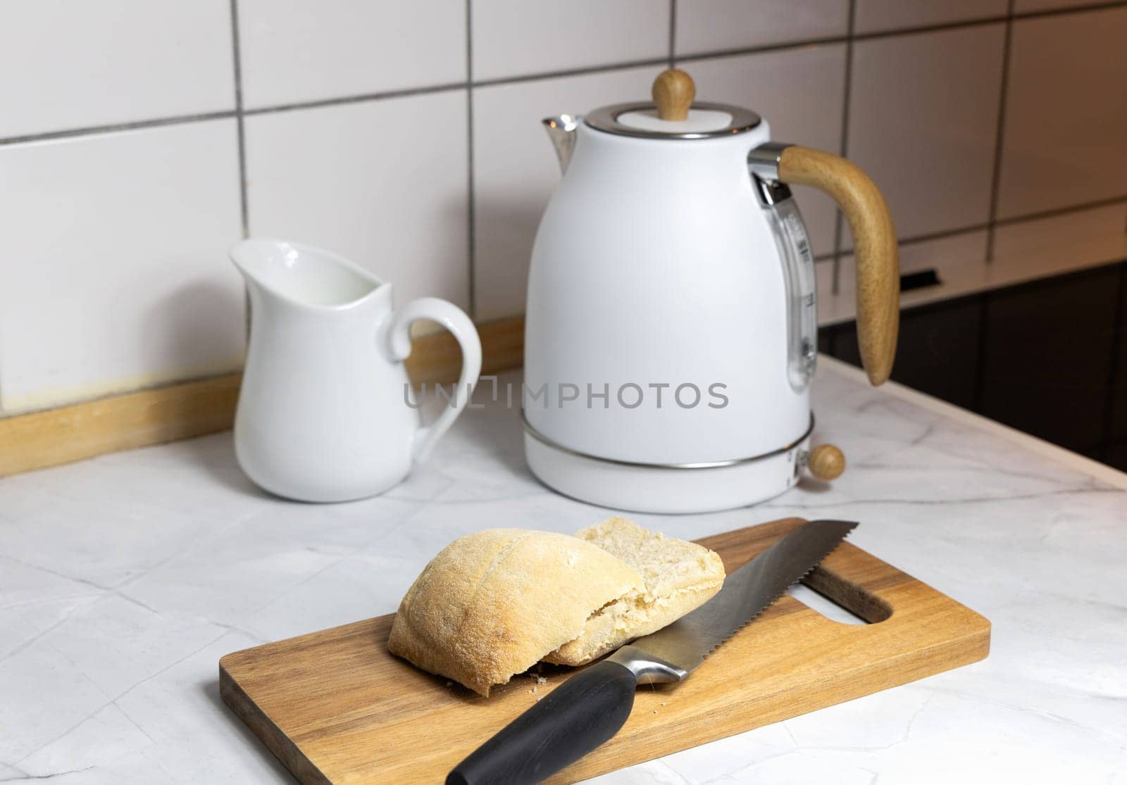 Breakfast on the kitchen table with fresh bread and coffee. High quality photo