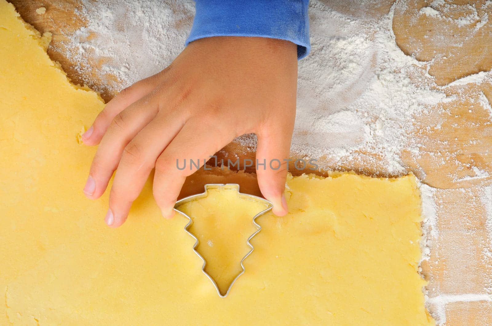 Cutting out Christmas cookies