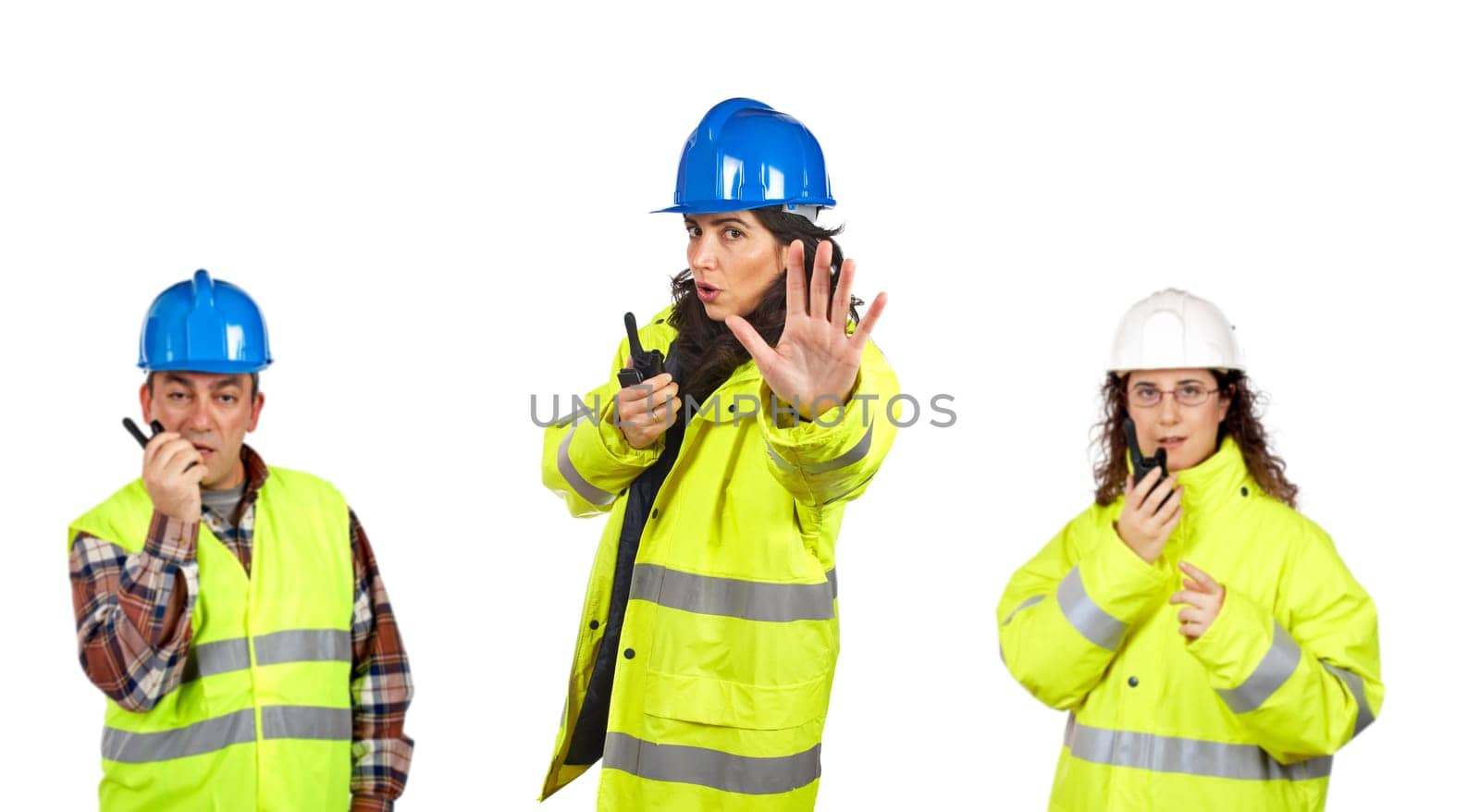 Construction workers talking with a walkie talkie