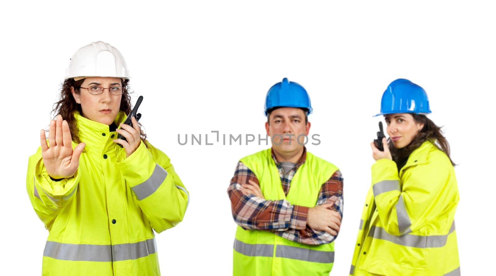 Construction workers talking with a walkie talkie