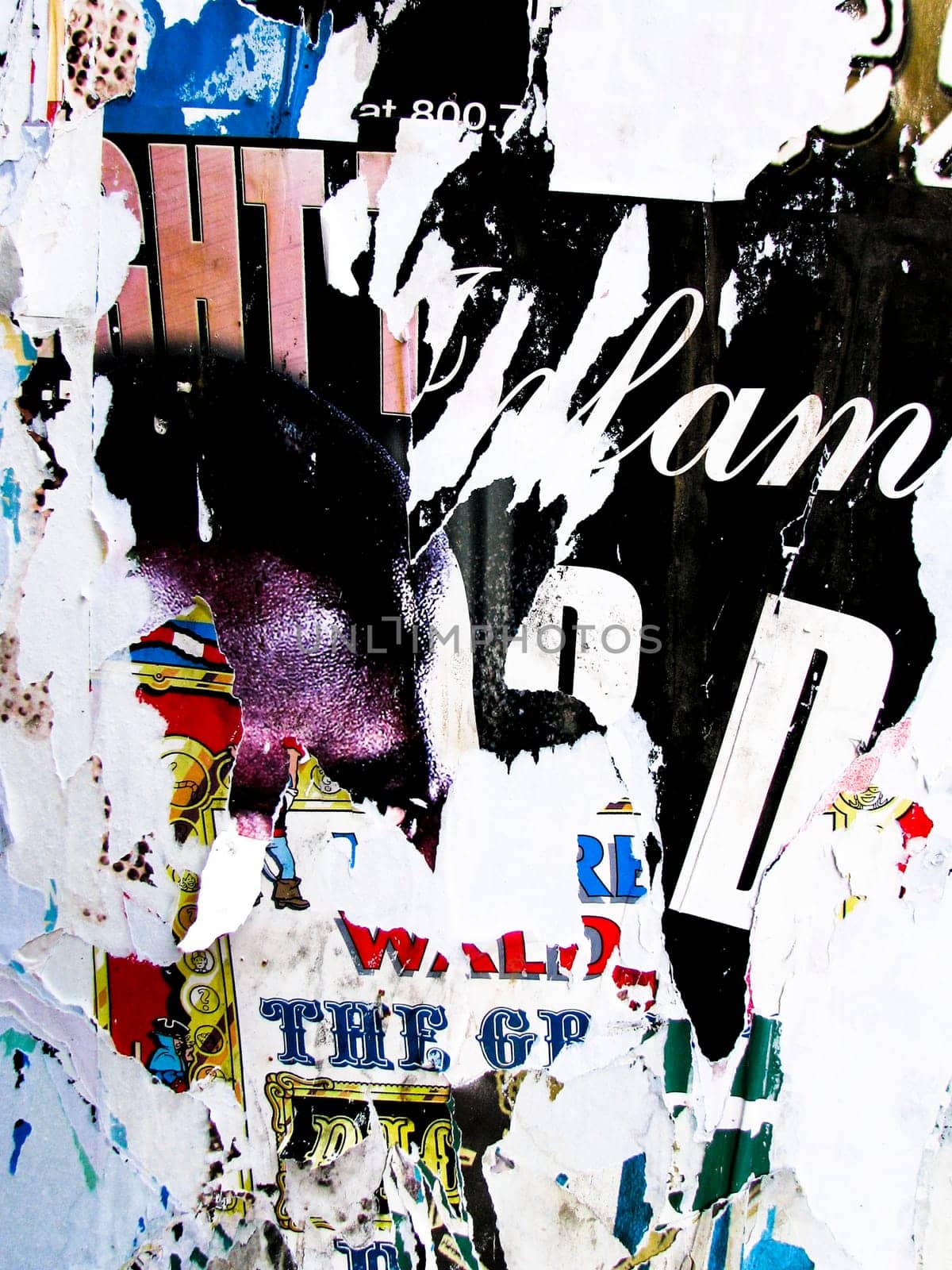 Torn up posters and garbage on a wall